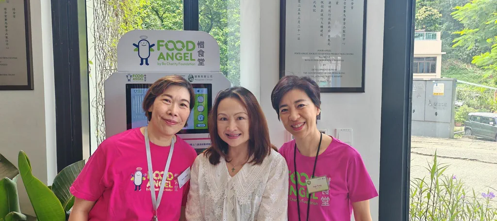 FreeComm director Candy Chui with two Food Angel team members at the new facility