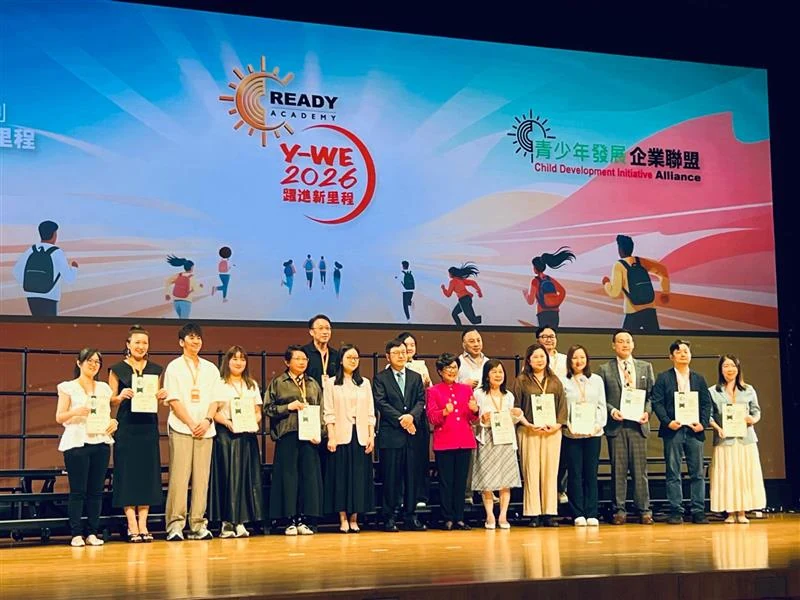 Participants holding certificates on stage at the CDIA Y-WE 2026 ceremony